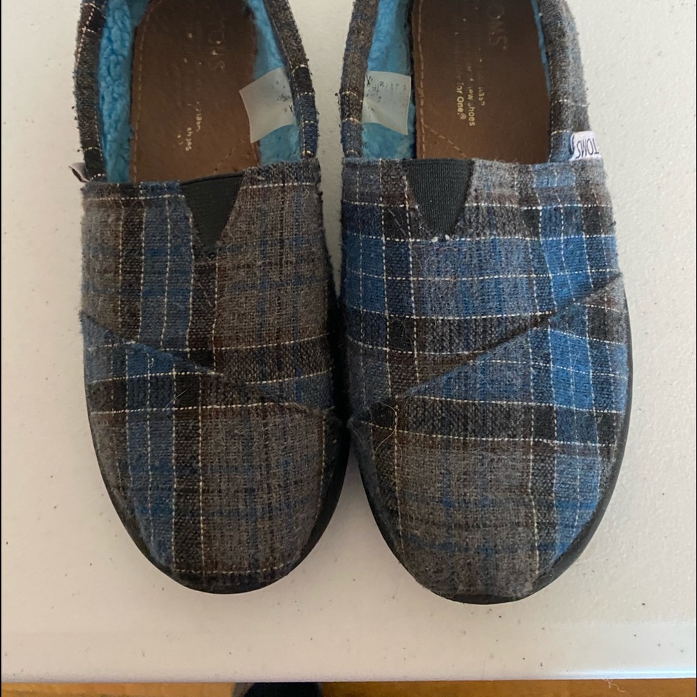 Toms hard soled slippers.